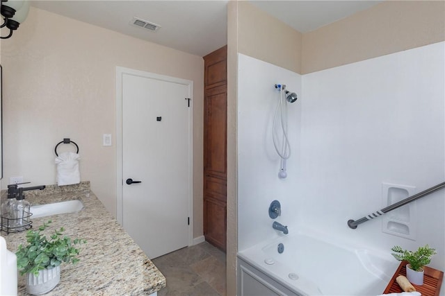 bathroom with shower / bathtub combination and vanity