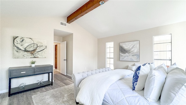 bedroom with lofted ceiling with beams and wood-type flooring