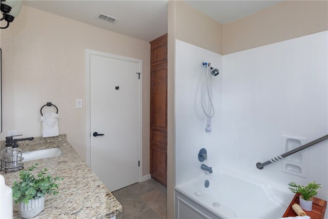 bathroom with vanity and shower / bath combination