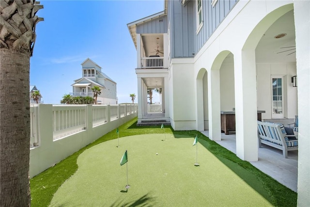 view of yard with ceiling fan