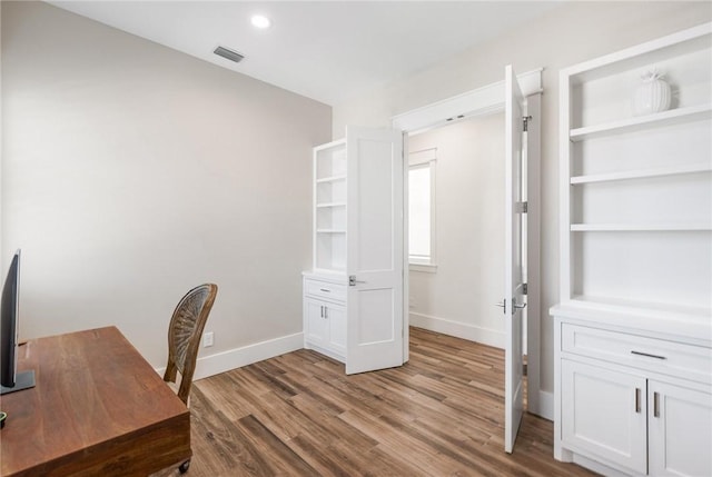 office with wood-type flooring