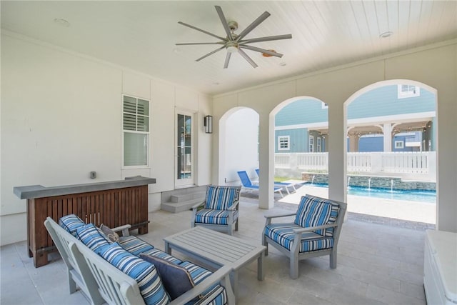 view of patio / terrace with outdoor lounge area, pool water feature, and ceiling fan