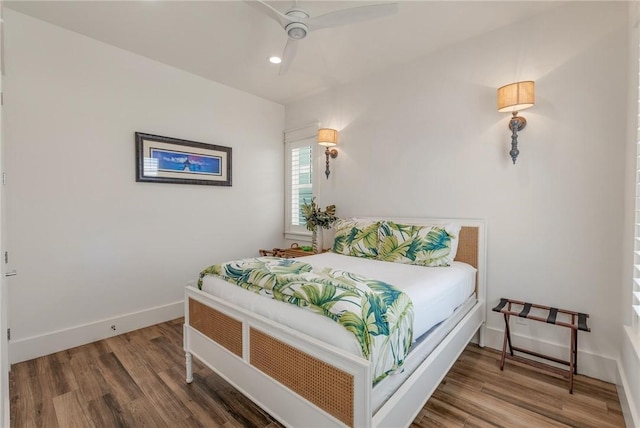 bedroom featuring ceiling fan and hardwood / wood-style floors