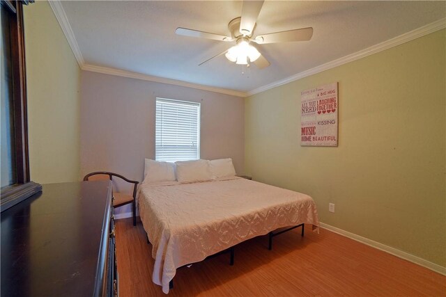 15426 Fortuna Bay Dr Unit 103, Corpus Christi, TX 78418 - bedroom featuring wood finished floors, baseboards, ornamental molding, and a ceiling fan