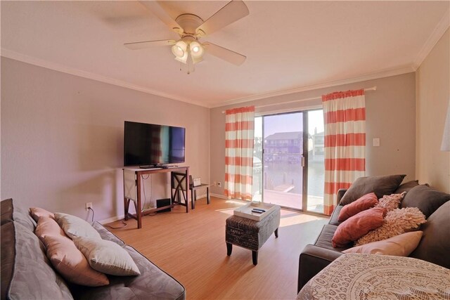 15426 Fortuna Bay Dr Unit 103, Corpus Christi, TX 78418 - living room with light wood-style floors, ornamental molding, a ceiling fan, and baseboards