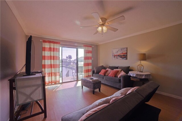 15426 Fortuna Bay Dr Unit 103, Corpus Christi, TX 78418 - living room featuring crown molding, wood finished floors, a ceiling fan, and baseboards