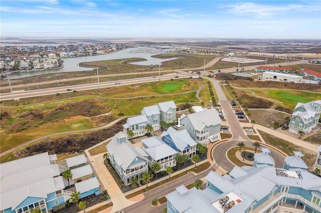 birds eye view of property with a water view and a residential view