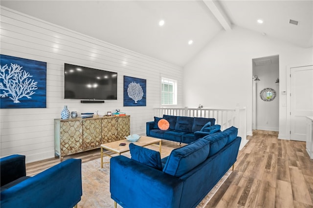 living area featuring baseboards, wood finished floors, high vaulted ceiling, beam ceiling, and recessed lighting