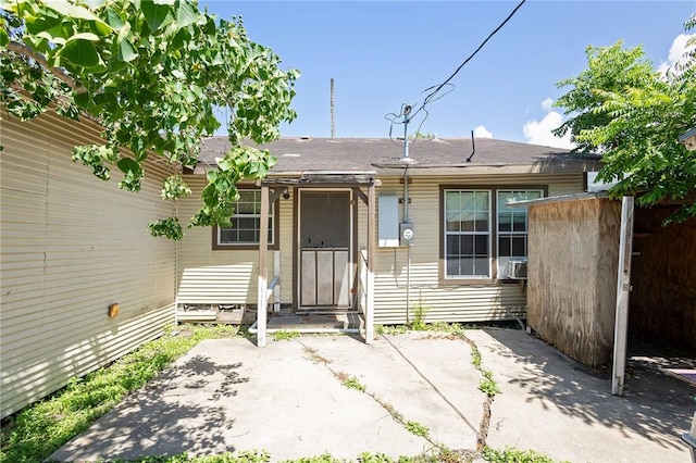 2407 David St, Corpus Christi, TX 78405 - property entrance featuring a patio area and a shingled roof