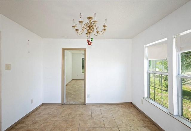 2407 David St, Corpus Christi, TX 78405 - unfurnished room with a chandelier and baseboards