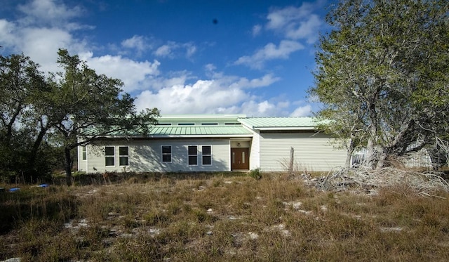 view of front of property featuring metal roof