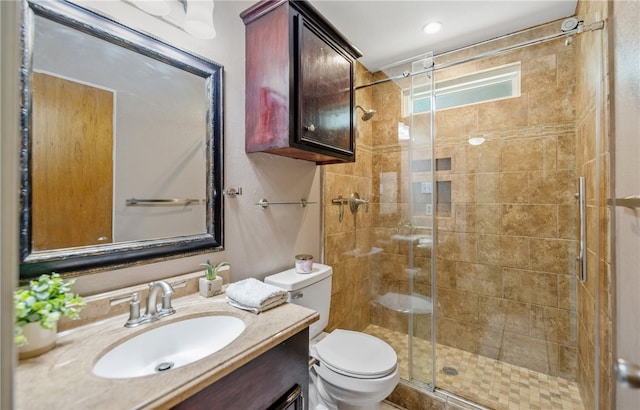 102 Mallard Dr, Aransas Pass, TX 78336 - bathroom featuring toilet, a shower stall, and vanity