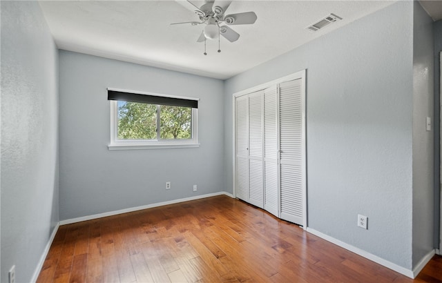 102 Mallard Dr, Aransas Pass, TX 78336 - unfurnished bedroom featuring wood-type flooring, a closet, and baseboards
