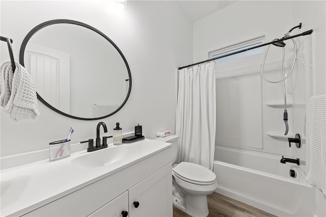 full bathroom with shower / bath combination with curtain, vanity, hardwood / wood-style flooring, and toilet