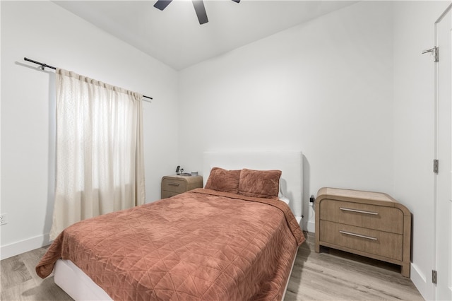 bedroom featuring ceiling fan and light hardwood / wood-style flooring