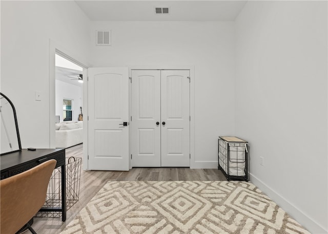 bedroom featuring a closet and light hardwood / wood-style floors