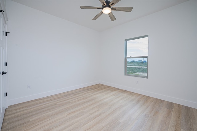 spare room with light hardwood / wood-style floors and ceiling fan