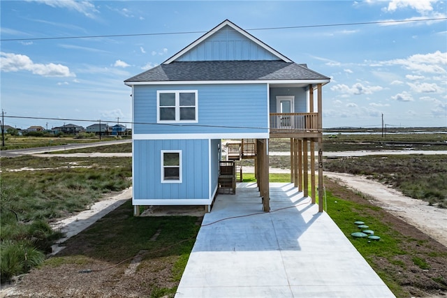 exterior space featuring a porch and a carport