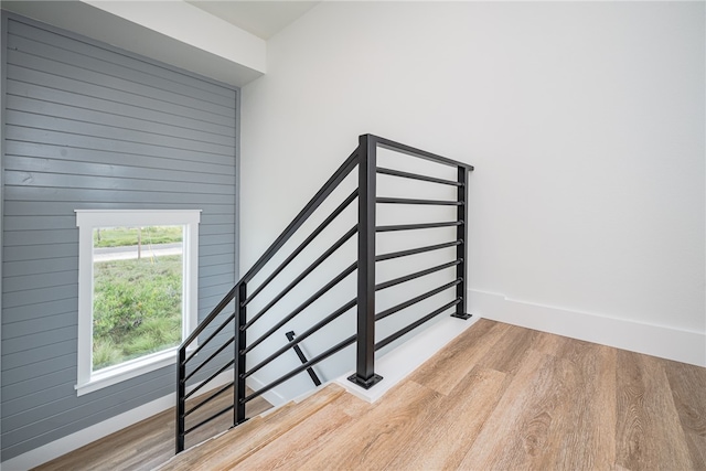 stairway with wood-type flooring