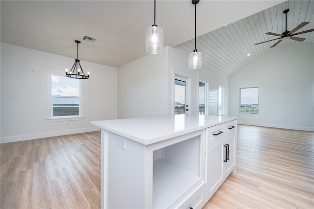 kitchen with a center island, wood ceiling, decorative light fixtures, and white cabinets