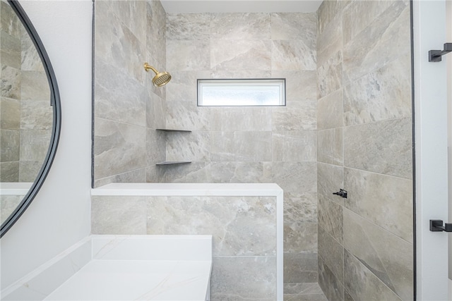 bathroom featuring tiled shower