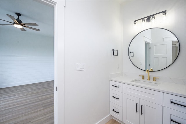 bathroom featuring vanity, hardwood / wood-style floors, and ceiling fan