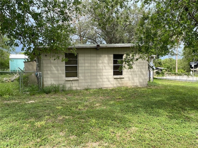 view of home's exterior with a yard