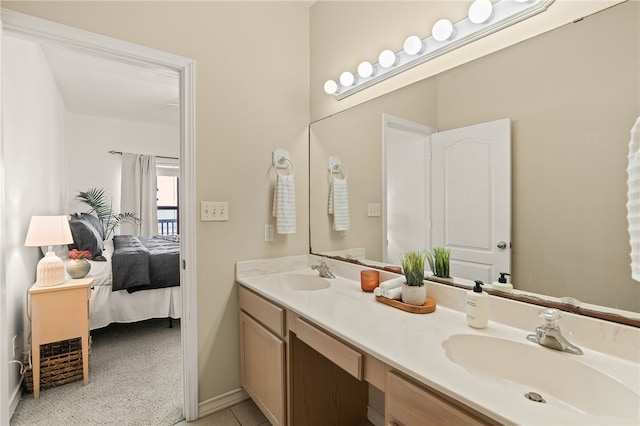 14901 Windward Dr Unit 403, Corpus Christi, TX 78418 - ensuite bathroom with baseboards and double vanity