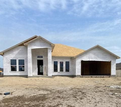 property in mid-construction with a garage