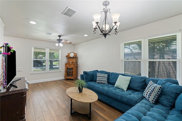 1010 Weber Pkwy, Corpus Christi, TX 78411 - living room with ceiling fan, wood finished floors, a chandelier, and recessed lighting