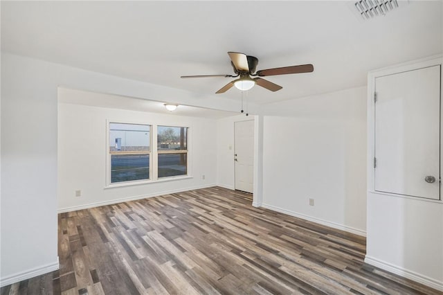 unfurnished room featuring ceiling fan and dark hardwood / wood-style flooring