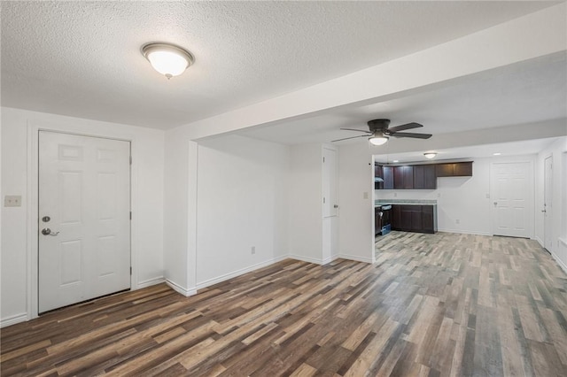 unfurnished bedroom featuring dark wood-type flooring and ceiling fan