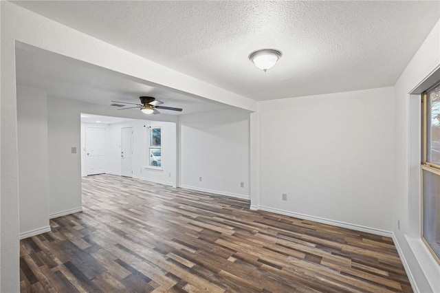 unfurnished bedroom with dark hardwood / wood-style floors, ceiling fan, and a closet