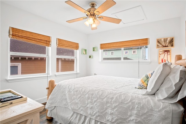 bedroom with hardwood / wood-style flooring and ceiling fan