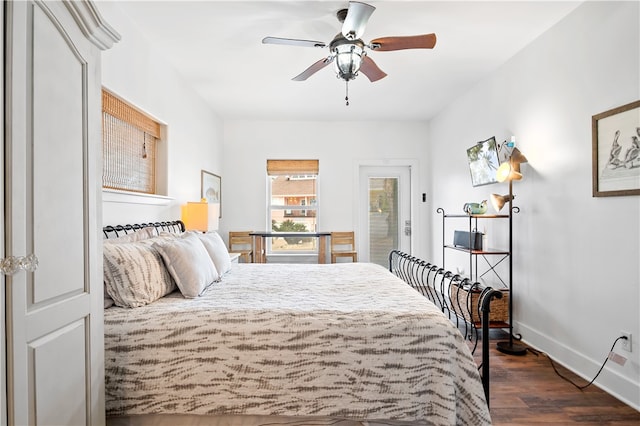 bedroom featuring dark wood-type flooring, ceiling fan, and access to exterior