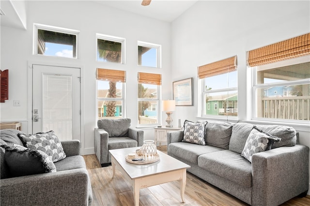 sunroom / solarium featuring ceiling fan and a healthy amount of sunlight