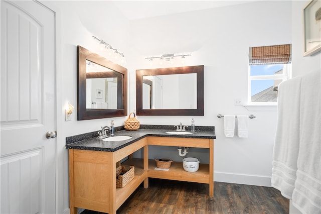 bathroom with vanity and hardwood / wood-style flooring