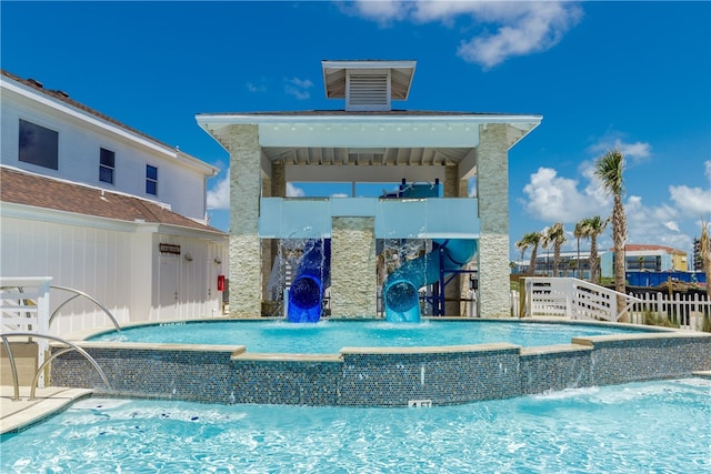 view of pool featuring pool water feature