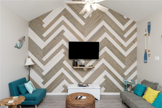 living room with wood-type flooring and ceiling fan