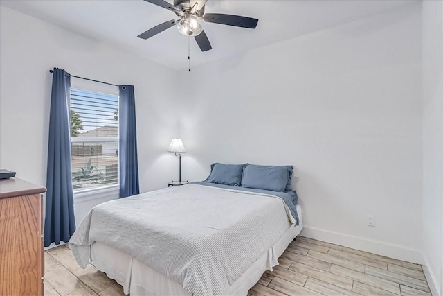 bedroom featuring ceiling fan and light hardwood / wood-style flooring