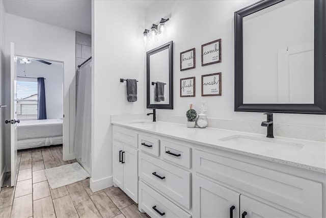 bathroom featuring ceiling fan and vanity