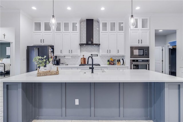 kitchen featuring pendant lighting, appliances with stainless steel finishes, and a large island