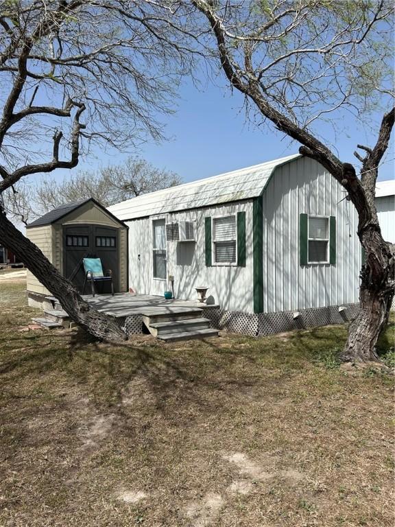 view of front of house featuring a garage and an outdoor structure