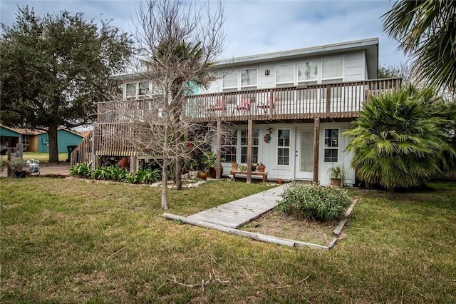 back of house with a yard, stairway, and a wooden deck