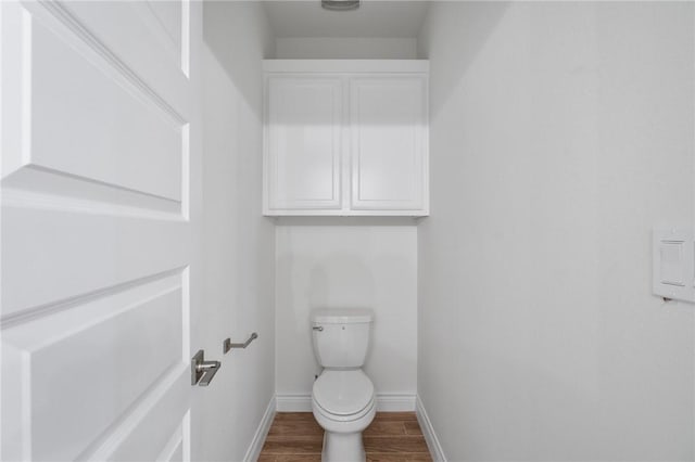 9409 Royal Oak Dr, Corpus Christi, TX 78410 - bathroom with baseboards and wood finished floors