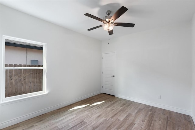 unfurnished room featuring ceiling fan and light wood-type flooring