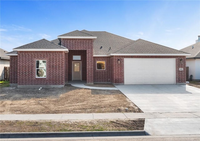 view of front of property with a garage