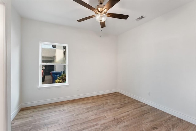 empty room featuring light hardwood / wood-style flooring and ceiling fan