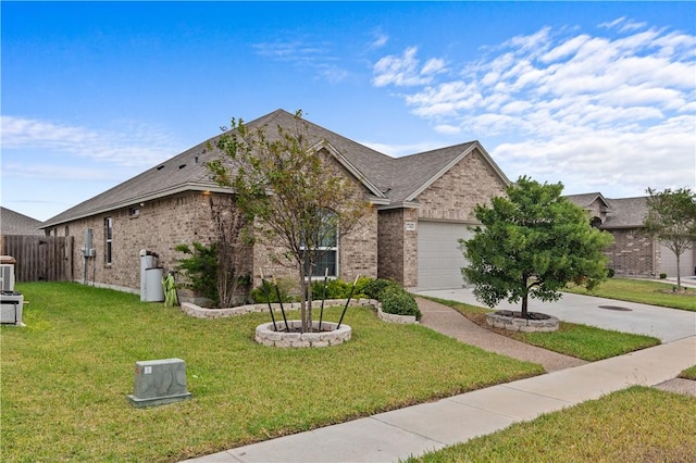 view of front facade featuring a garage and a front lawn