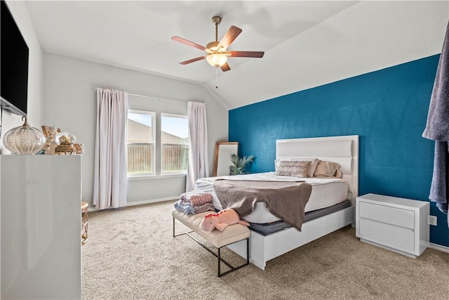 bedroom with carpet floors, vaulted ceiling, and ceiling fan